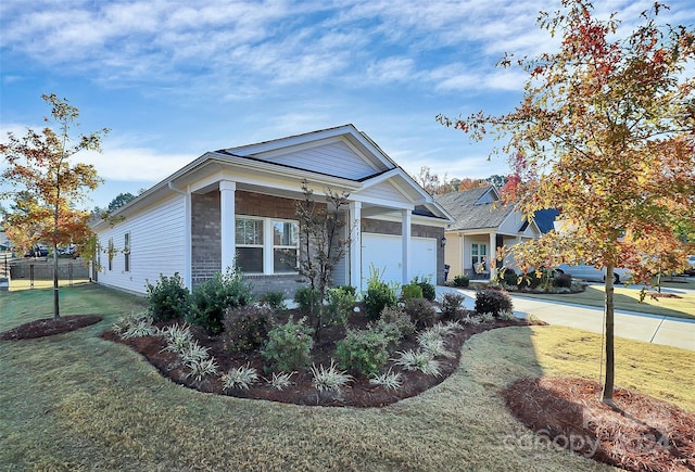 view of front facade with a front yard and a garage