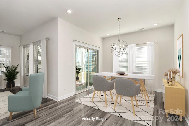 dining space featuring a notable chandelier and hardwood / wood-style floors