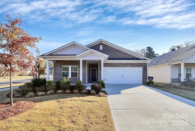 view of front of home with a porch, a front lawn, and a garage