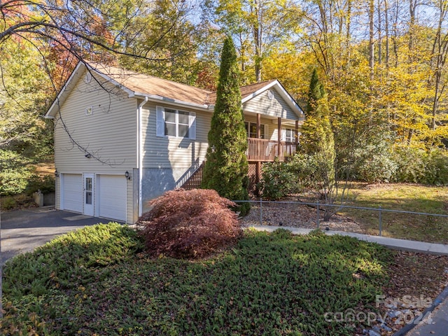 view of side of home featuring a garage