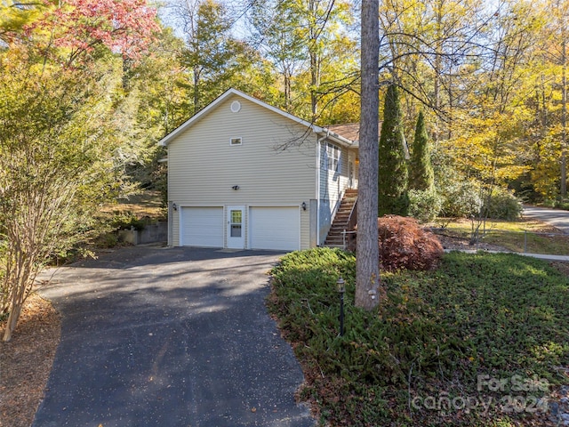 view of home's exterior with a garage