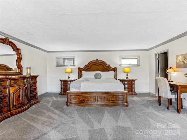 carpeted bedroom featuring crown molding and a textured ceiling