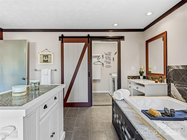 bathroom featuring vanity, a tub to relax in, and tile patterned floors