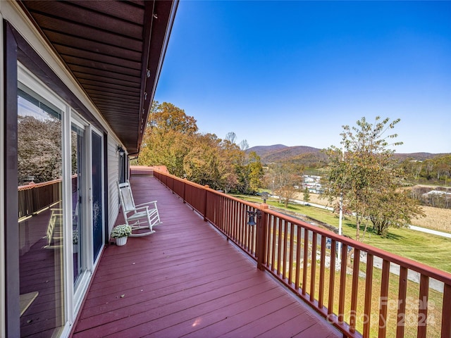 wooden deck featuring a mountain view