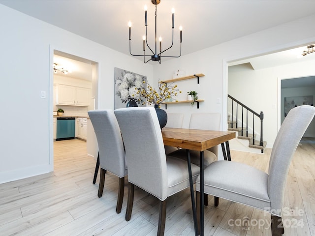 dining space with a chandelier and light wood-type flooring