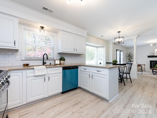 kitchen featuring white cabinets, stainless steel appliances, and plenty of natural light