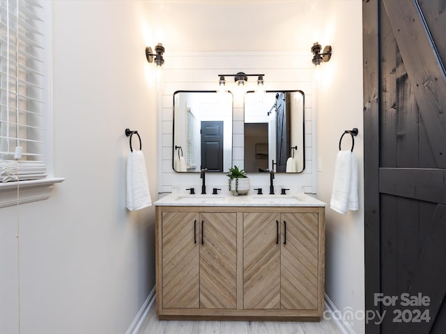 bathroom featuring vanity and wood-type flooring