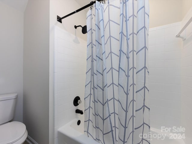 bathroom featuring toilet and shower / bathtub combination with curtain