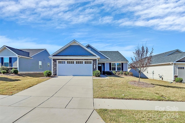 view of front of house with a garage and a front lawn