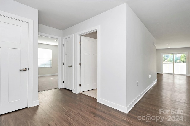 hall with dark hardwood / wood-style flooring