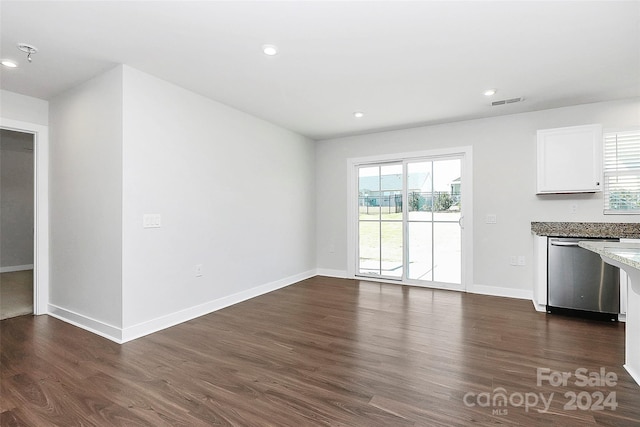 unfurnished dining area with a healthy amount of sunlight and dark wood-type flooring