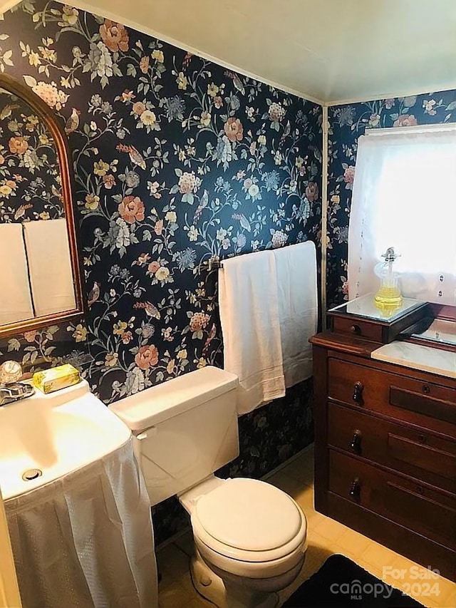 115 S Pearl St, Troy, NC 27371 - bathroom with vanity, toilet, and tile patterned floors