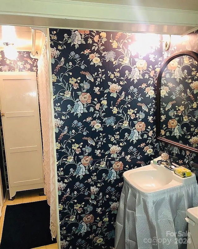 115 S Pearl St, Troy, NC 27371 - bathroom featuring sink and tile patterned flooring