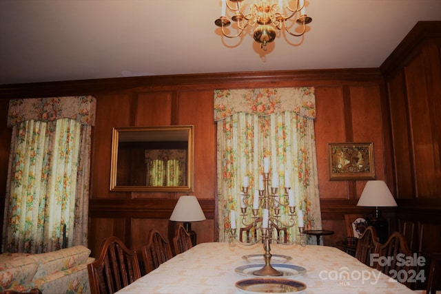 115 S Pearl St, Troy, NC 27371 - dining space featuring wooden walls and an inviting chandelier