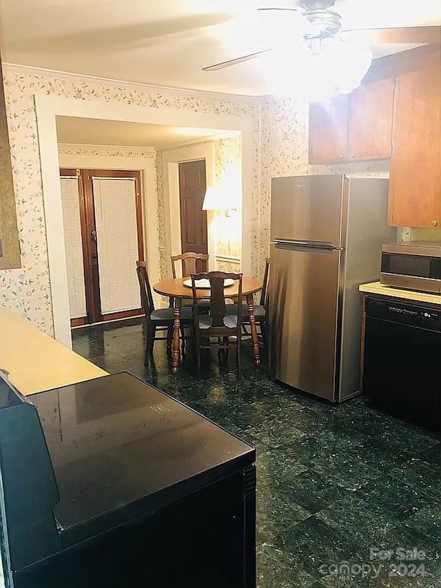 115 S Pearl St, Troy, NC 27371 - kitchen featuring ceiling fan and stainless steel appliances