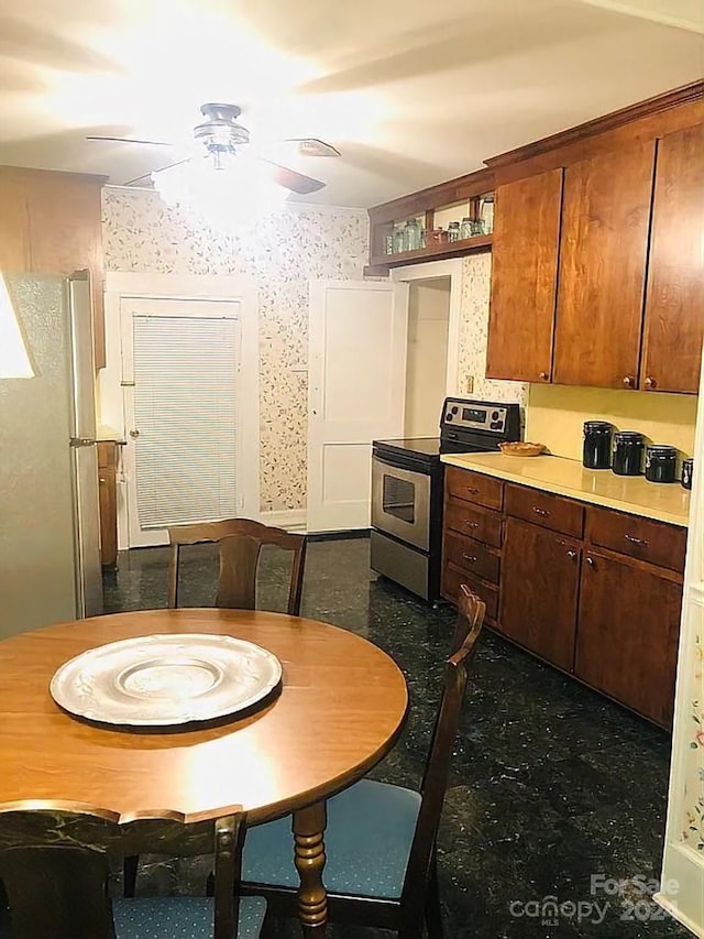 115 S Pearl St, Troy, NC 27371 - kitchen with appliances with stainless steel finishes and ceiling fan