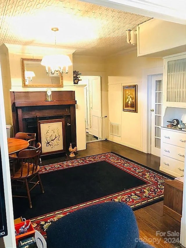 115 S Pearl St, Troy, NC 27371 - interior space featuring dark hardwood / wood-style floors, a chandelier, and a textured ceiling