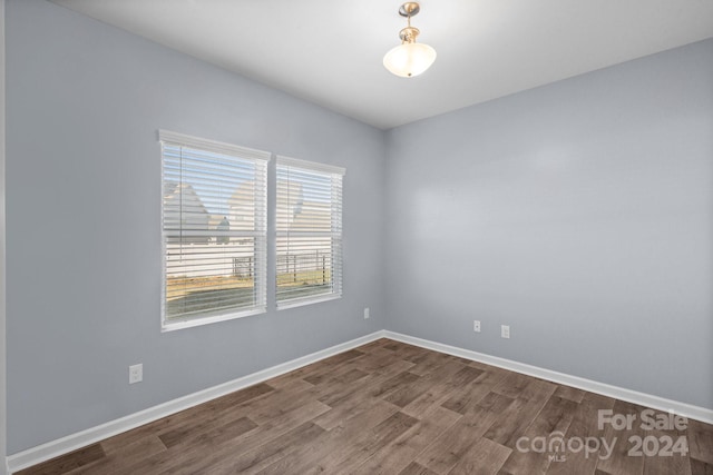 spare room featuring hardwood / wood-style floors