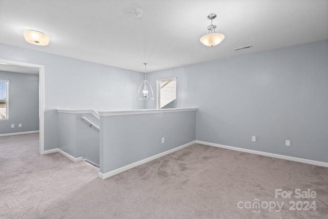 empty room with light colored carpet