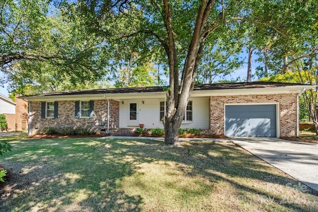 ranch-style home with a garage and a front lawn