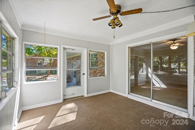 unfurnished sunroom with ceiling fan