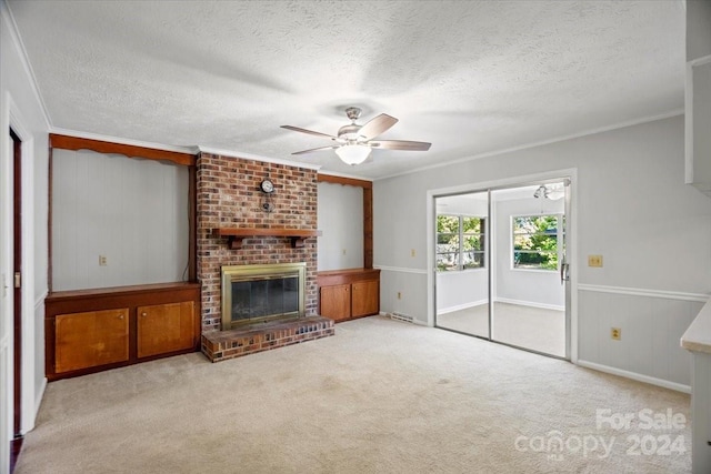 living room featuring crown molding, light carpet, and a fireplace