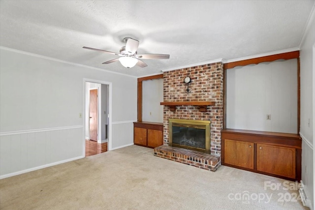 unfurnished living room featuring light carpet, crown molding, a brick fireplace, a textured ceiling, and ceiling fan