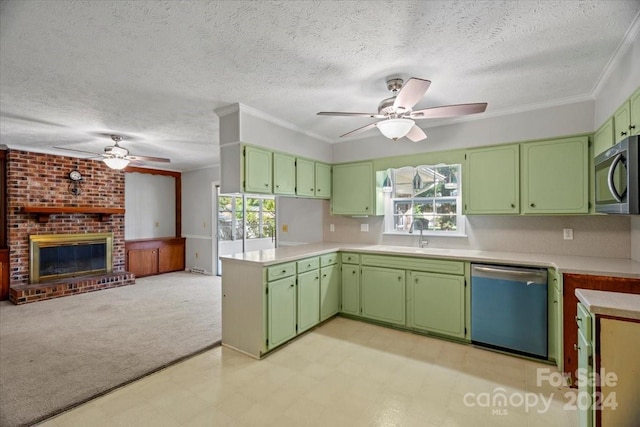 kitchen featuring appliances with stainless steel finishes, green cabinets, and a wealth of natural light