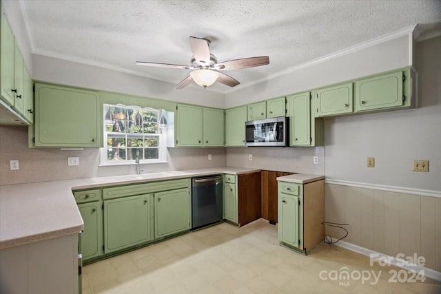 kitchen featuring crown molding, appliances with stainless steel finishes, and green cabinets