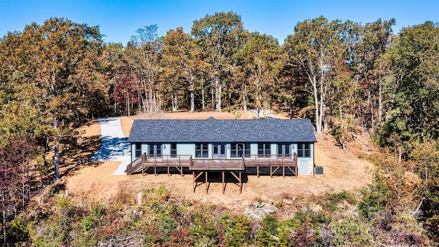 back of property featuring a wooden deck