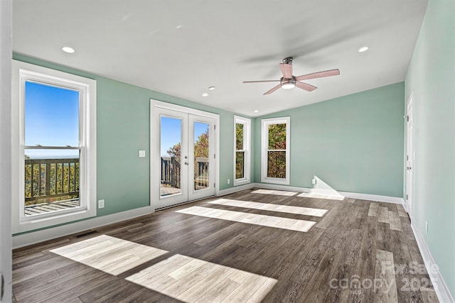 spare room featuring french doors, ceiling fan, lofted ceiling, and wood-type flooring