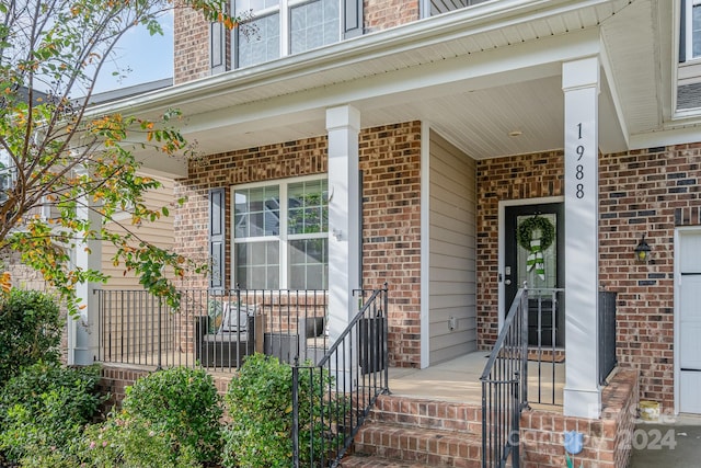 property entrance with covered porch