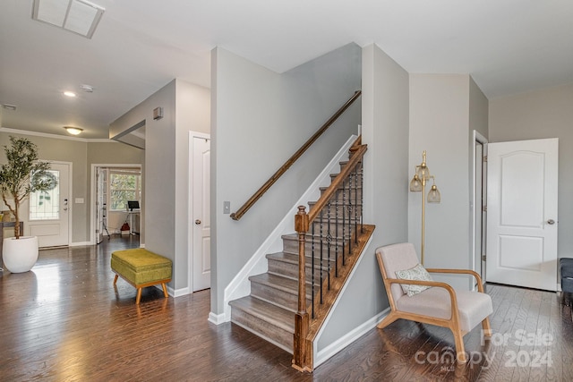 stairs featuring hardwood / wood-style flooring