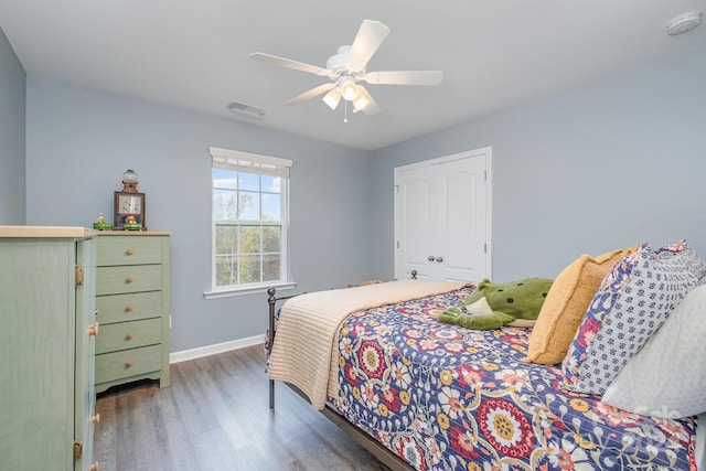 bedroom featuring ceiling fan and dark hardwood / wood-style floors