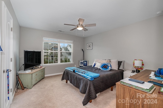 carpeted bedroom with ceiling fan