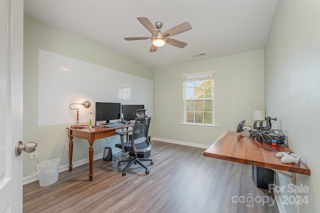 home office with hardwood / wood-style flooring and ceiling fan