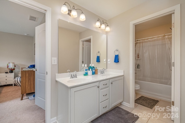 full bathroom featuring shower / bath combo, tile patterned flooring, vanity, and toilet