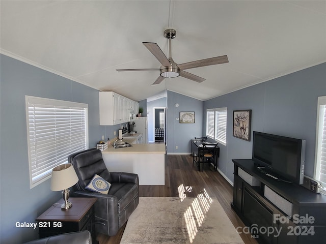 living room with ceiling fan, crown molding, vaulted ceiling, and dark hardwood / wood-style floors