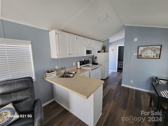 kitchen featuring white appliances, kitchen peninsula, lofted ceiling, white cabinets, and dark hardwood / wood-style floors