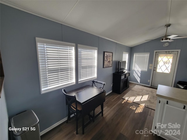 dining space with dark hardwood / wood-style floors, ceiling fan, and vaulted ceiling