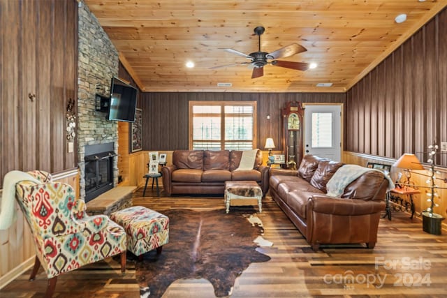 living room featuring lofted ceiling, wood ceiling, a fireplace, and hardwood / wood-style flooring