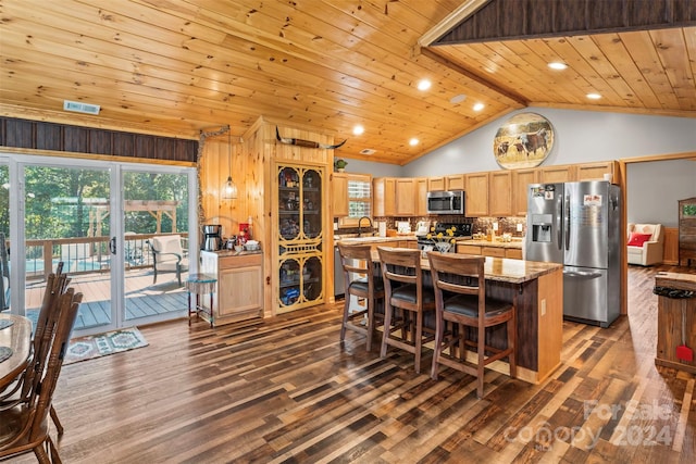 kitchen featuring dark wood-type flooring, lofted ceiling with beams, wood ceiling, and stainless steel appliances