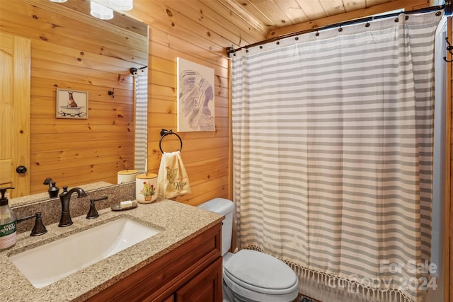 bathroom with wood ceiling, toilet, wooden walls, a shower with curtain, and vanity