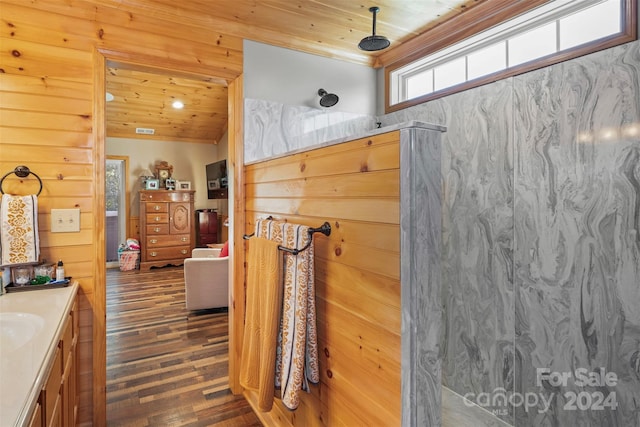 bathroom featuring vanity, wood ceiling, a shower, and wood-type flooring