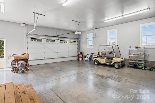 garage featuring a garage door opener