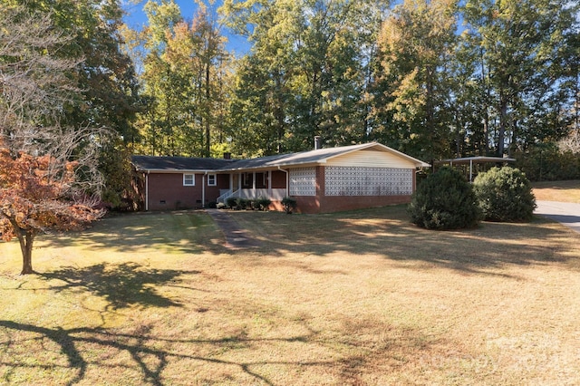 ranch-style home with a front lawn