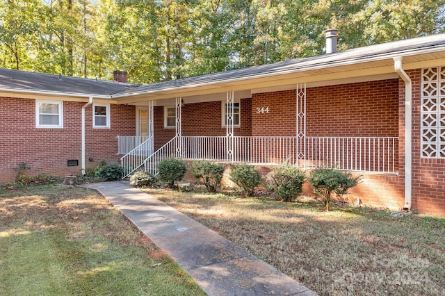 entrance to property featuring covered porch