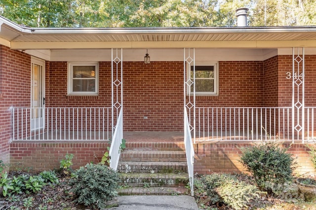 doorway to property featuring covered porch