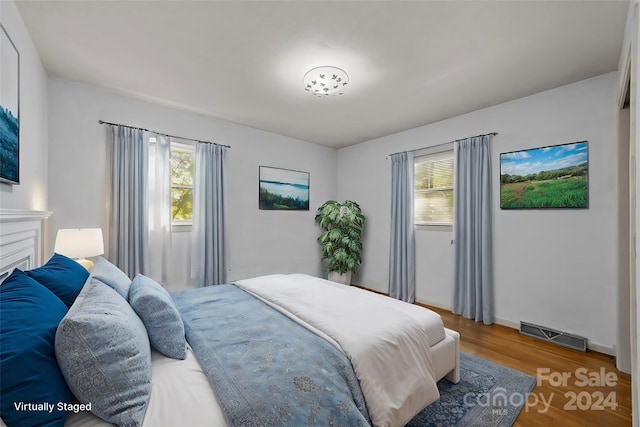 bedroom with wood-type flooring