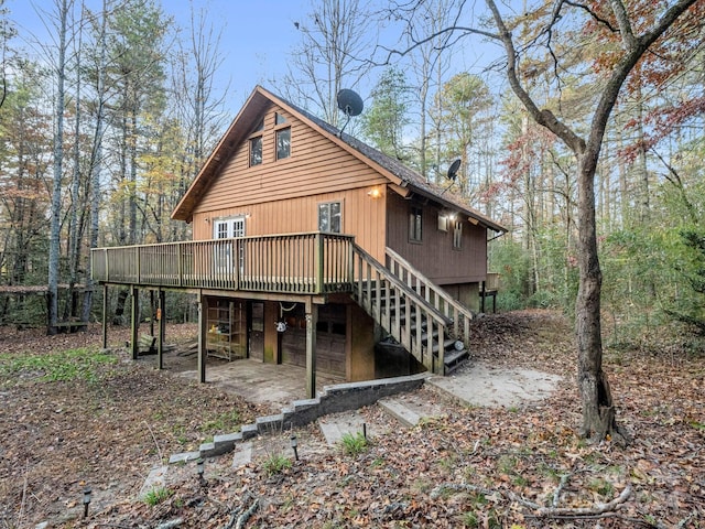 back of house with a wooden deck